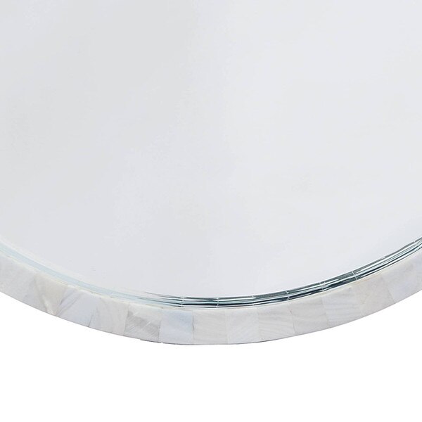 Bottom edge of a Regina Andrew Mother of Pearl Mirror